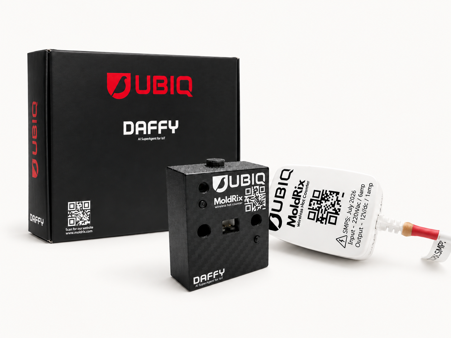 Moldrix wireless mould shot counter beside its power supply and Ubiq Daffy packaging