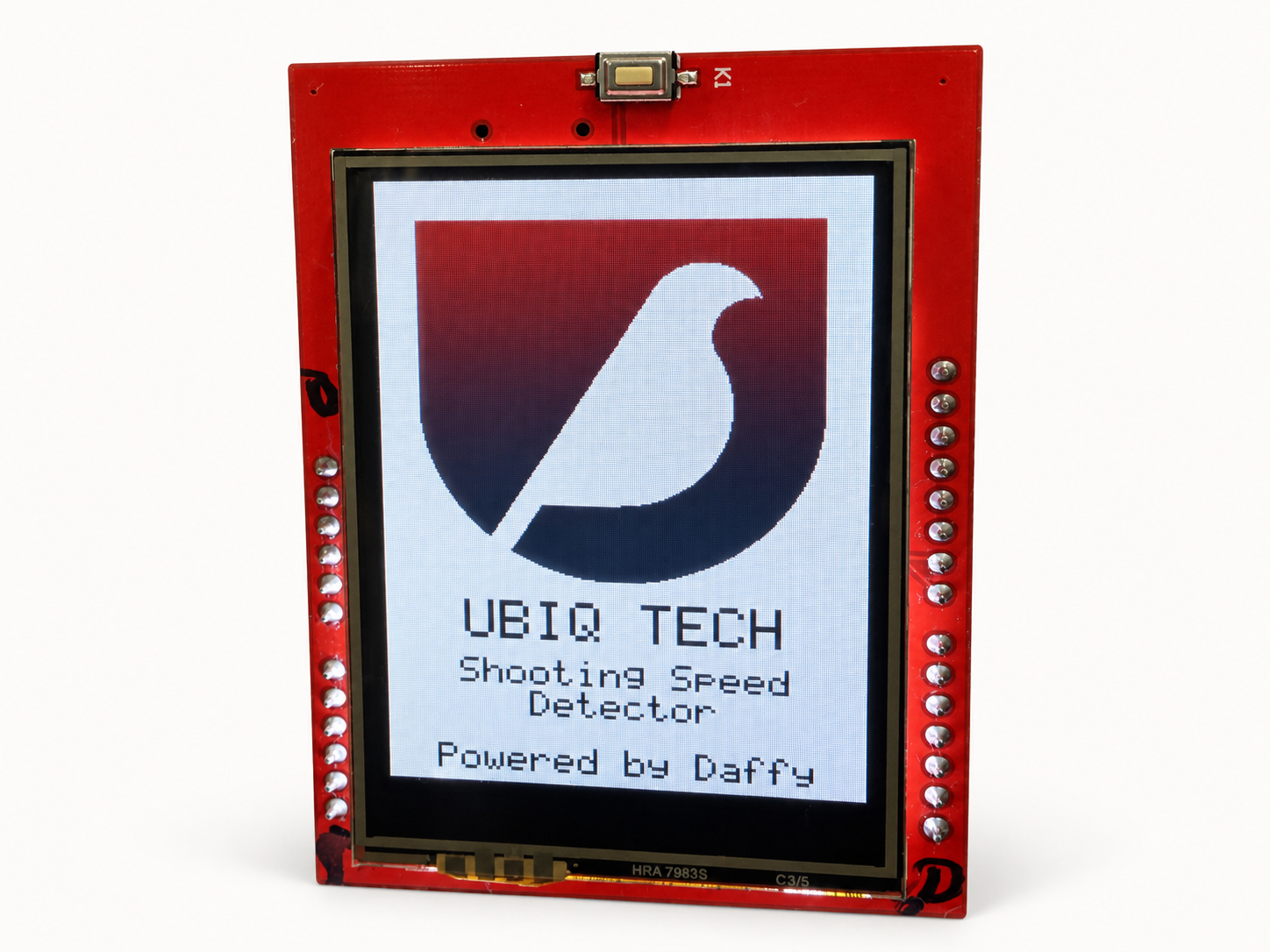 Ubiq Shooting Speed Detector with an exposed red circuit board and a display reading Powered by Daffy